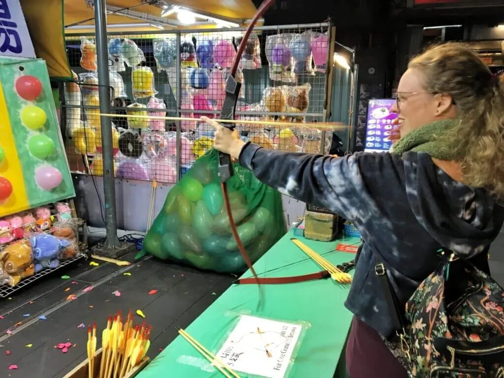 Playing games at the Shilin Night Market in Taipei