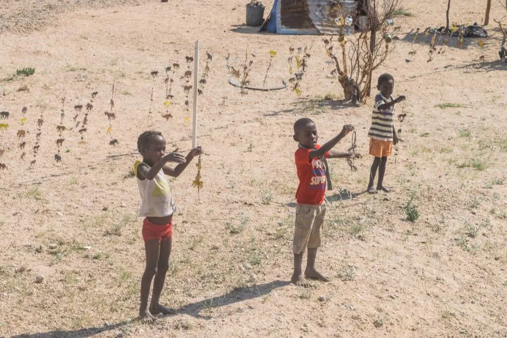 namibian road trip spitzkoppe children selling jewelry