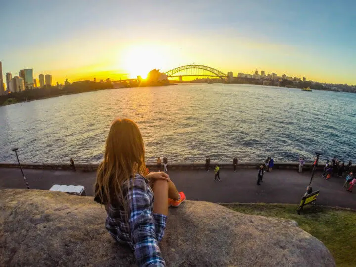 best sydney sunset spots - sunset from Mrs Macquarie's Chair behind opera house and harbour bridge