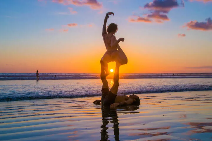 Envision Festival Guide Review sunset uvita beach acro yoga
