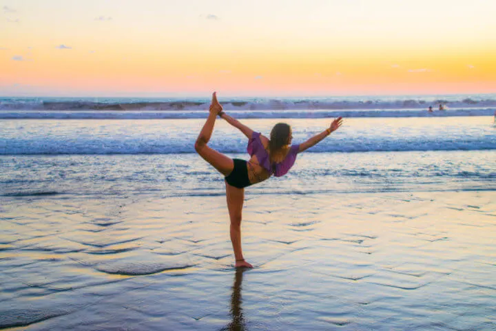 Envision Festival Review yoga sunset envision festiva location Uvita beach dancer pose