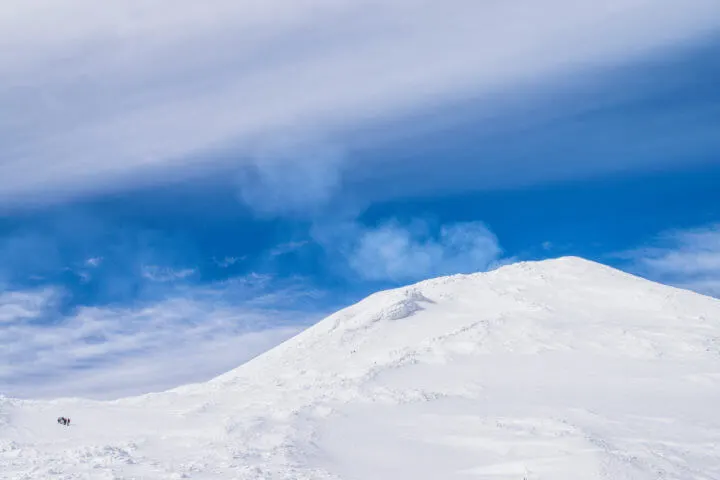 people climbing volcan villarrica in the distance