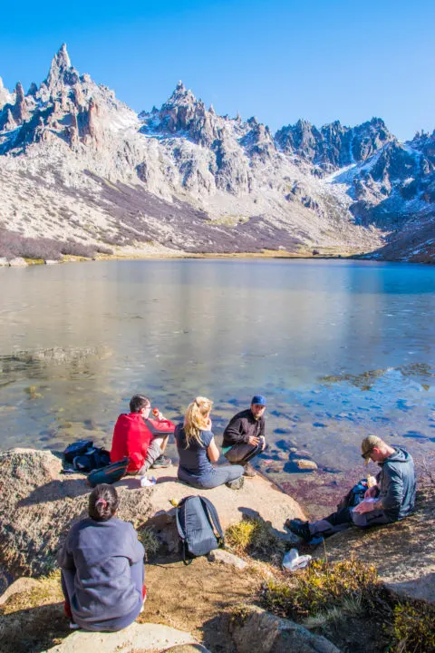 lunch on the lake at the refugio frey hike in bariloche argentina