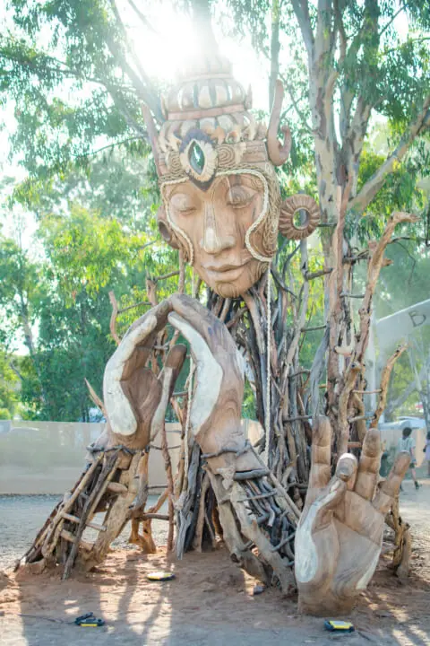 babylon festival art installation wooden buddha