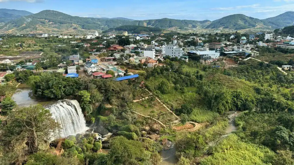 View from inside the Linh Anh Pagoda over Elephant Waterfall and the surrounding mountain landscape in Vietnam