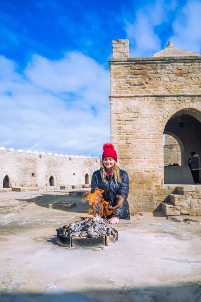 me at Ateshgah Zoroastrian Fire Temple warming my hands baku