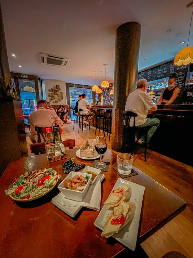 tosca tapas bar barcelona - brie, chorizo, and goats cheese salad tapas
