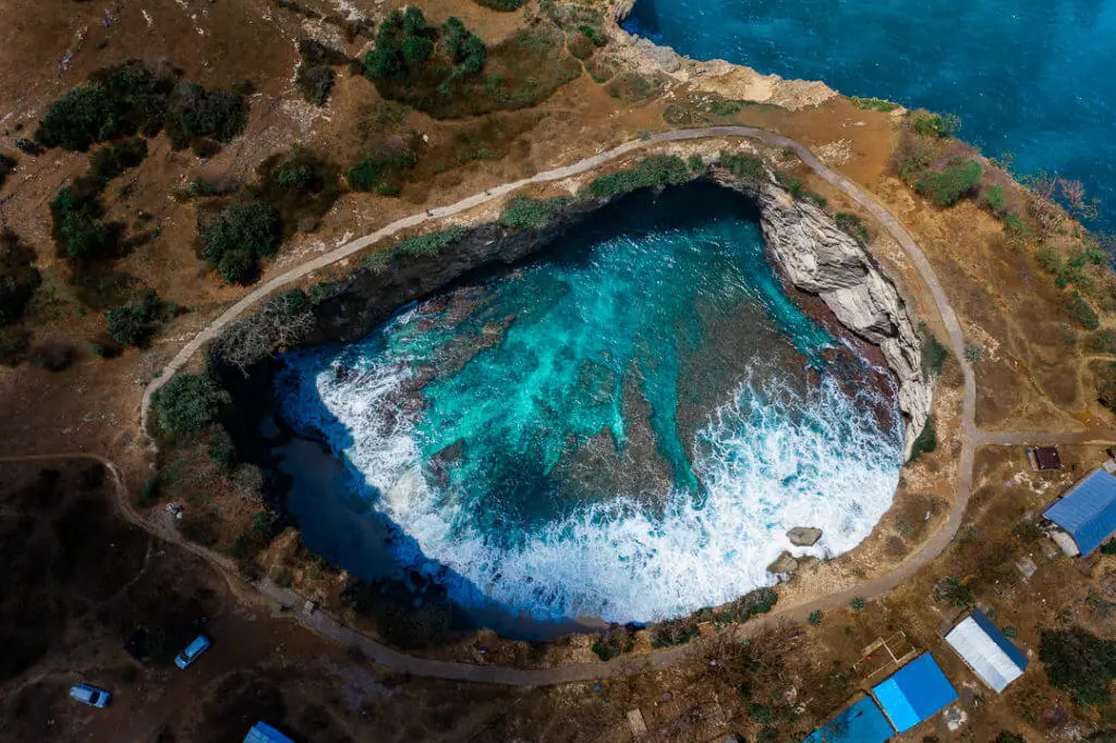 Broken beach nusa penida drone shot open circle beach waves