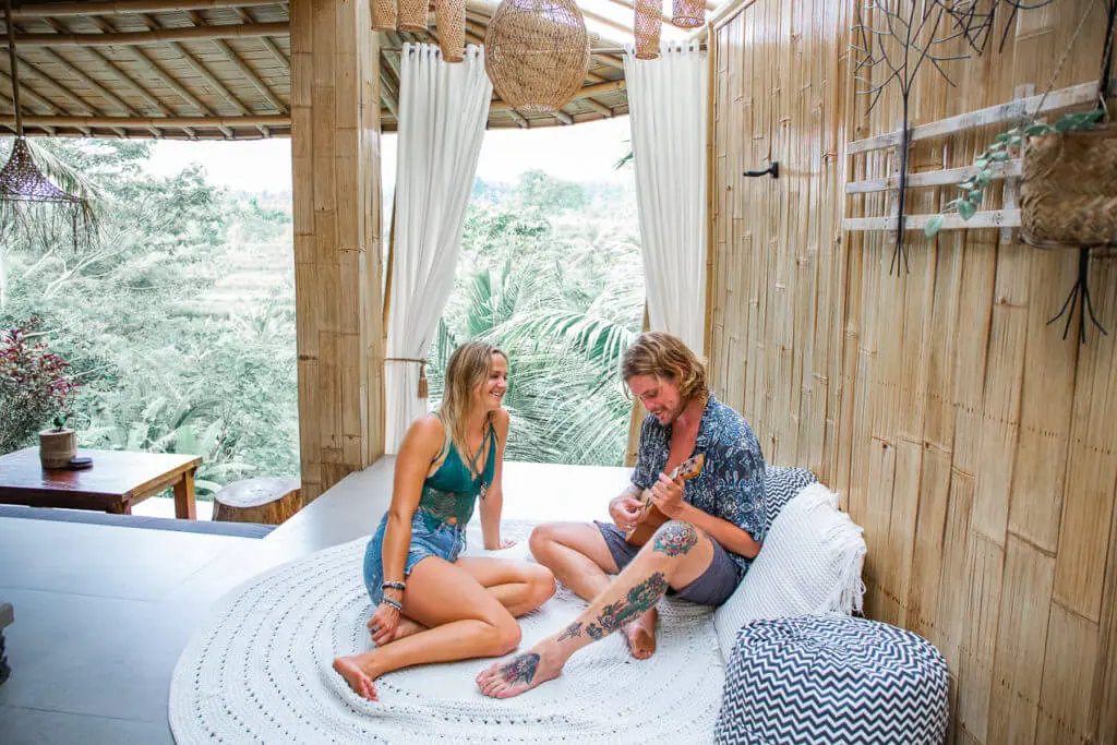 Camaya Bali bamboo house couple playing ukelele