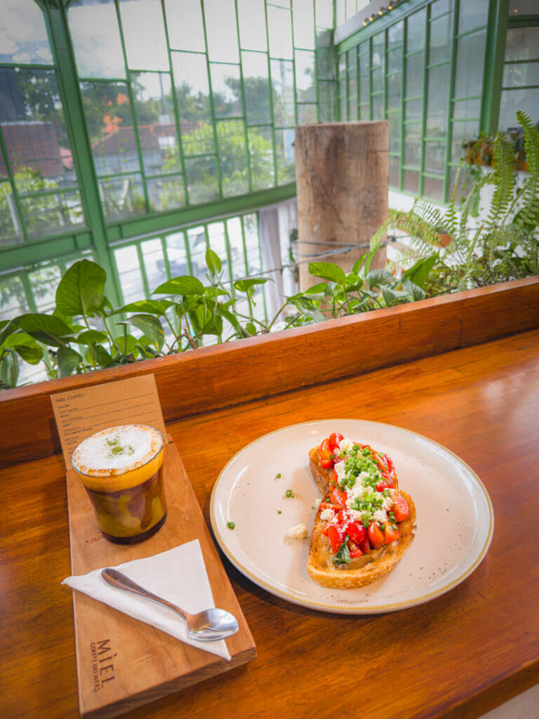Miel canggu cafe for brunch tomato toast and signature coffee 