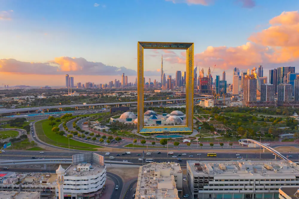 The famous Dubai Frame bridging the old and new town areas aerial view at sunset