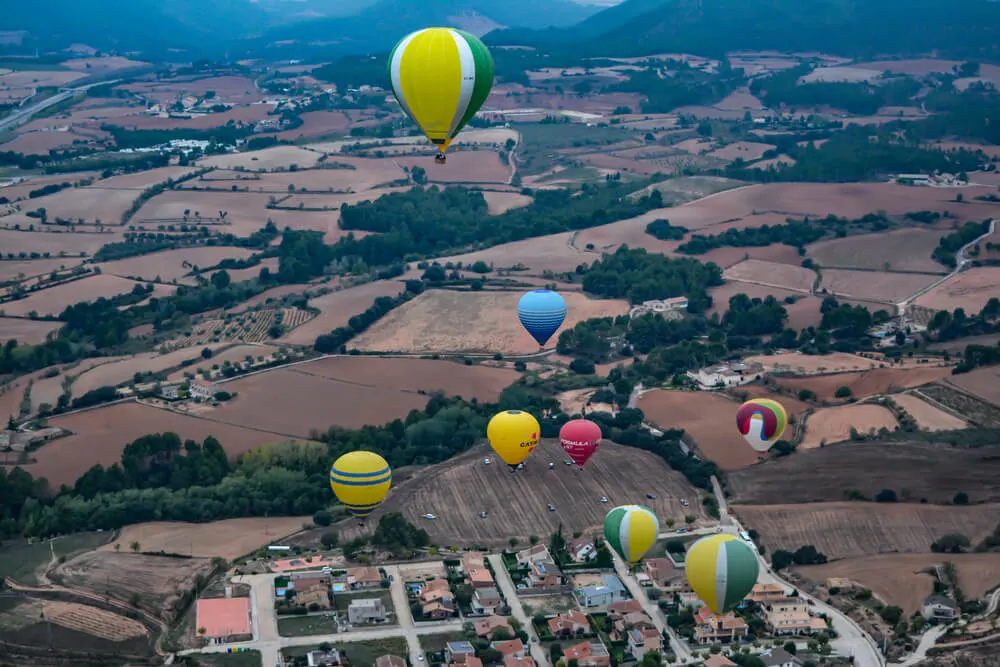 Ho air balloon flight near barcelona over catalonia for sunrise - countryside views