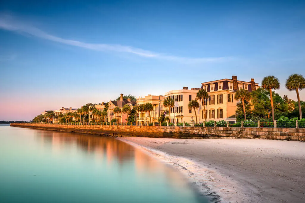the beautiful Battery with historic homes along the water front is a fun place for couples to visit in Charleston SC