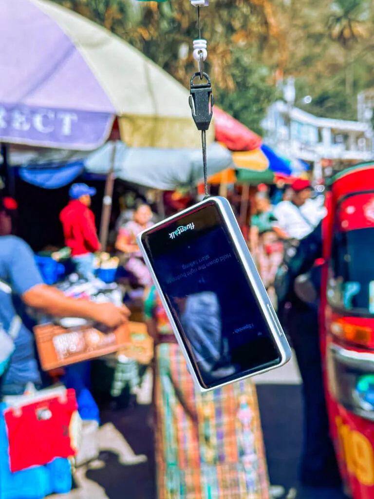 Using a handheld translator at a market