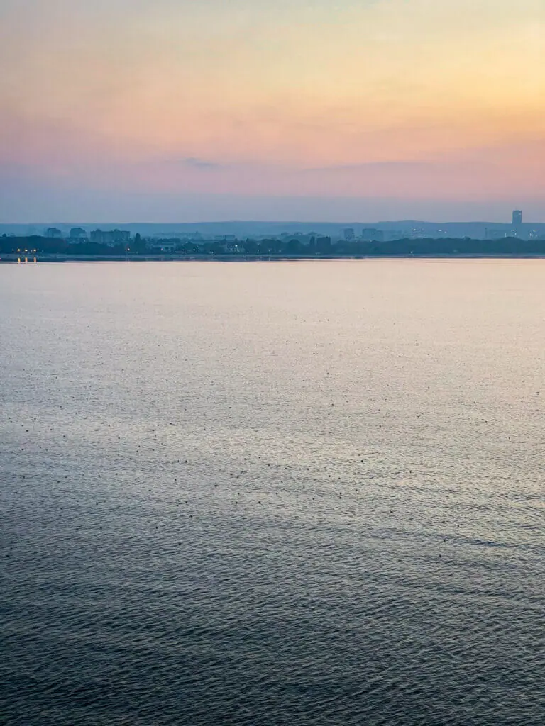 Birds and sunset waters while leaving the port in Gdansk Poland