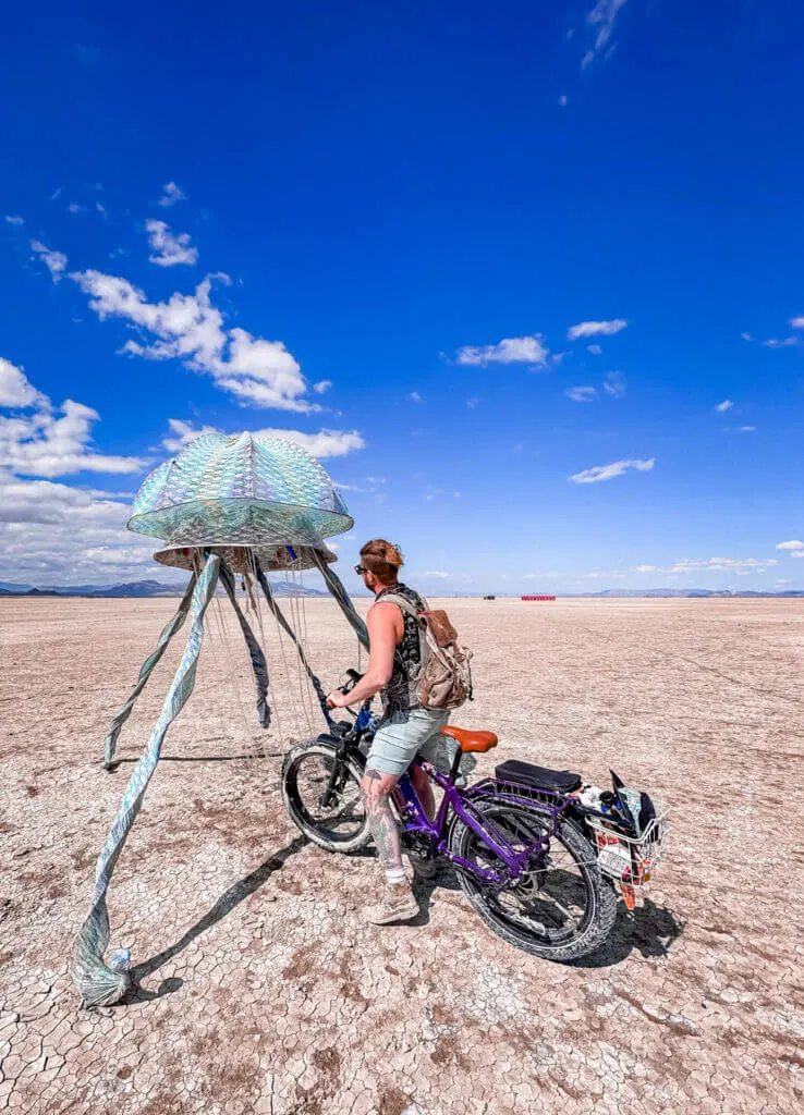 exploring art at burning man on an e bike