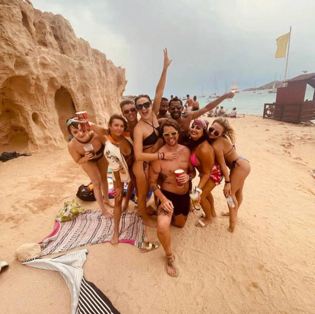 groups of travelers on the beach in ibiza