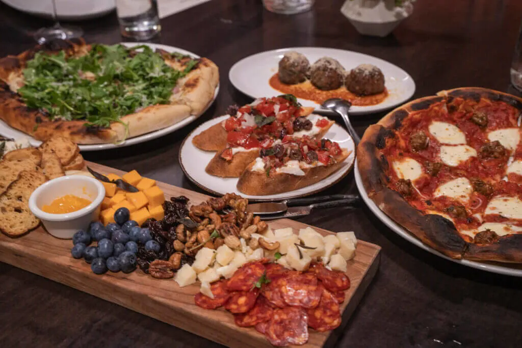 Genisa Wine Bar Janesville Italian restaurant cheese and meat borad pizza meatballs bruschetta