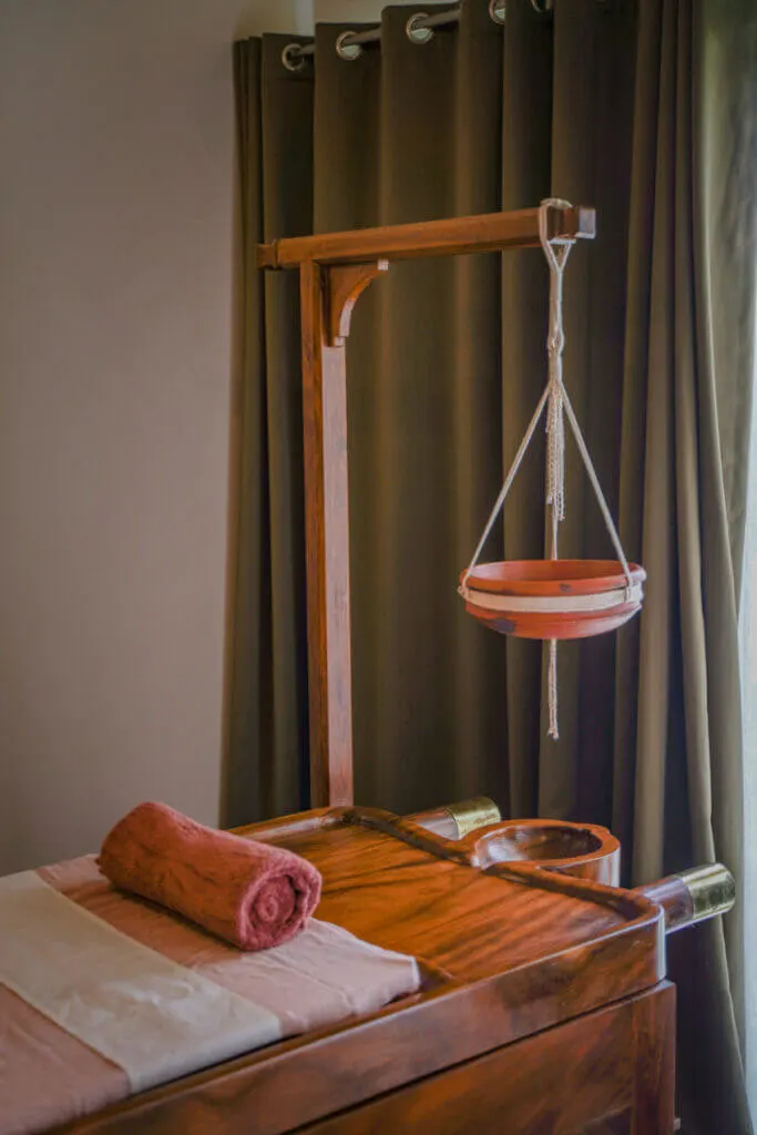 ayurveda treatment table at jeevess resort kerala vythiri