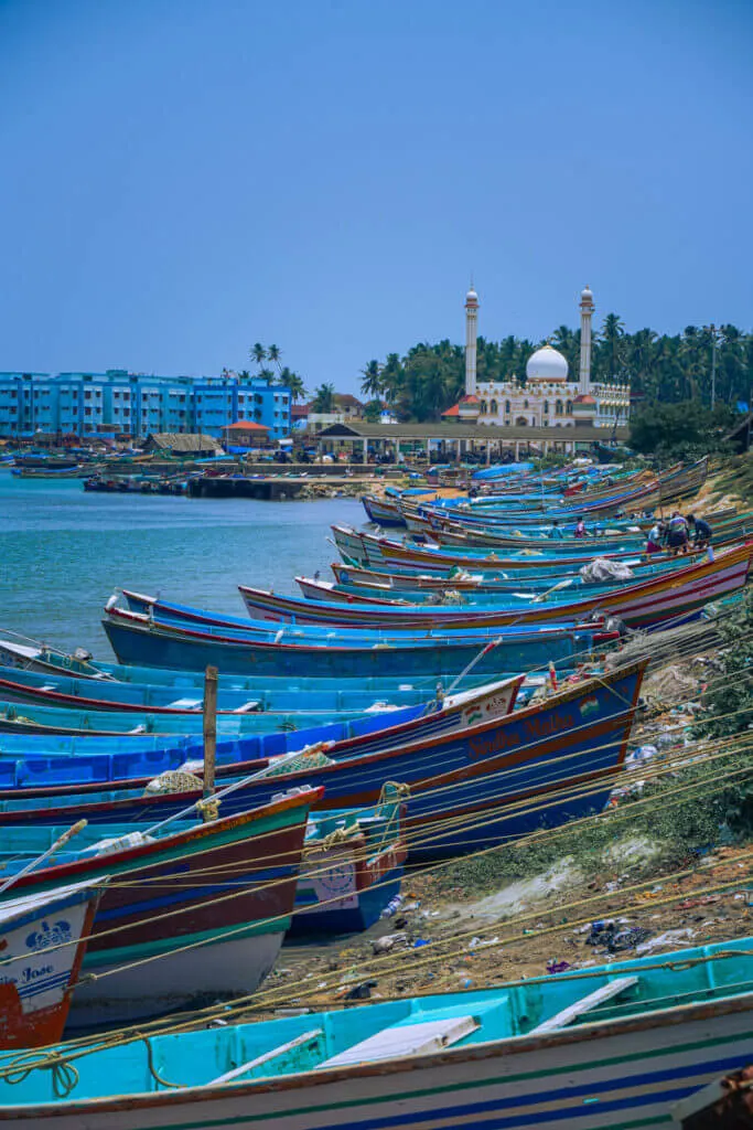 Places to visit in Kovalam Vizhinjam Fishing Village boats and mosque