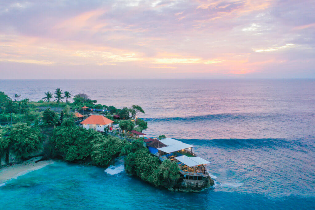Mahana point restaurant bar nusa ceningan sunset aerial view with surfing waves