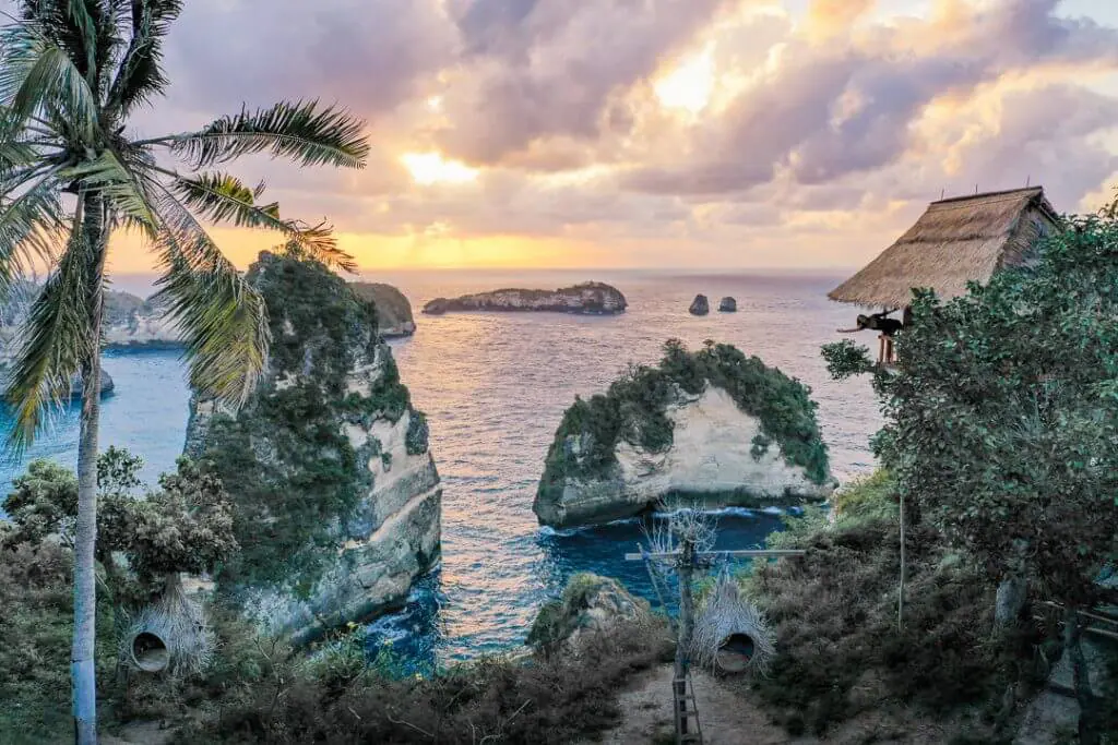 sunrise drone shot over thousand islands viewpoint and treehouse nusa penida