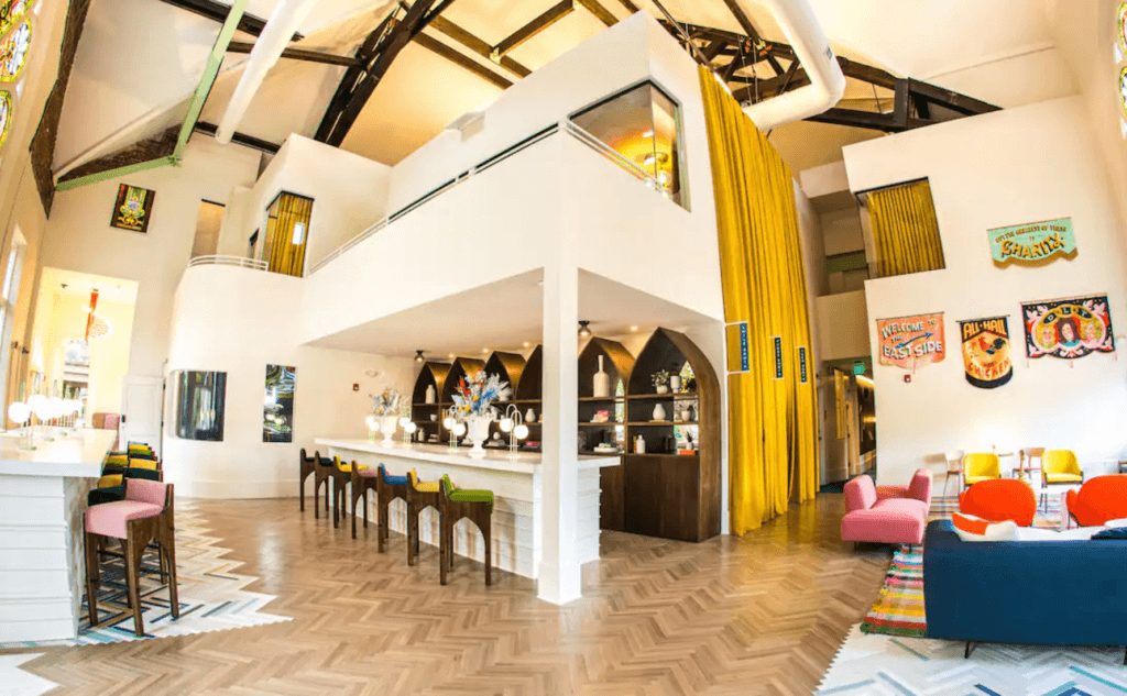 The Russell Unique refurbished church hotel in east nashville lobby with bar and high ceilings