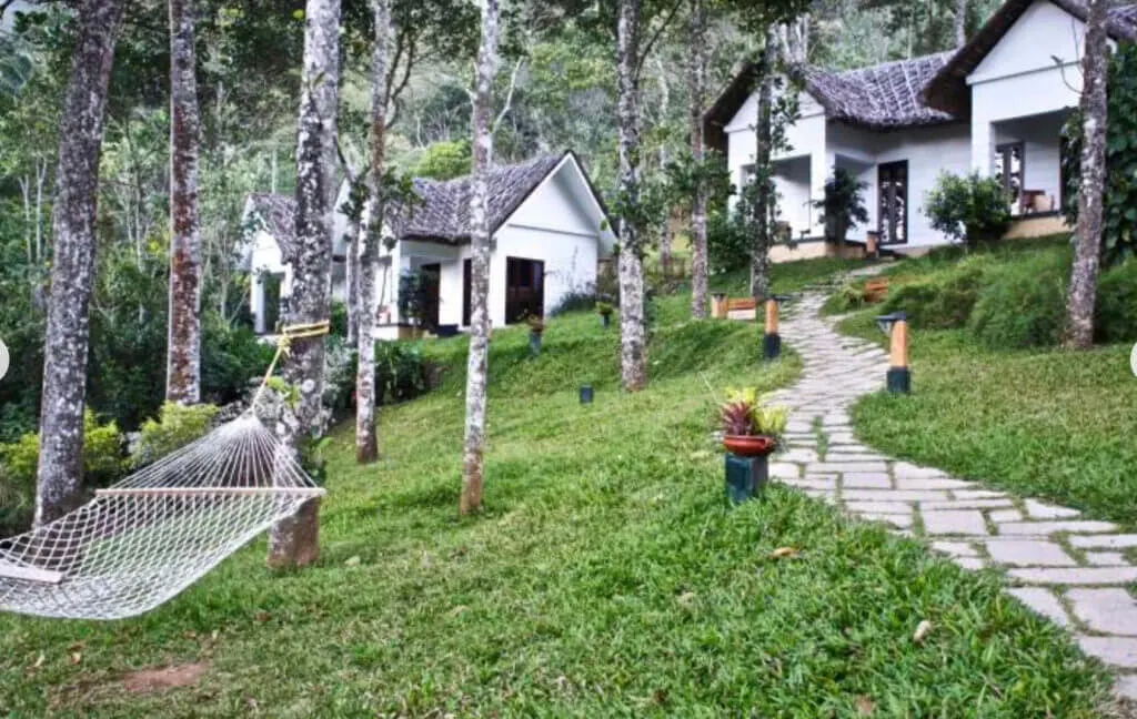 Niraamaya Retreats Cardamom Club private garden cottages on a hill