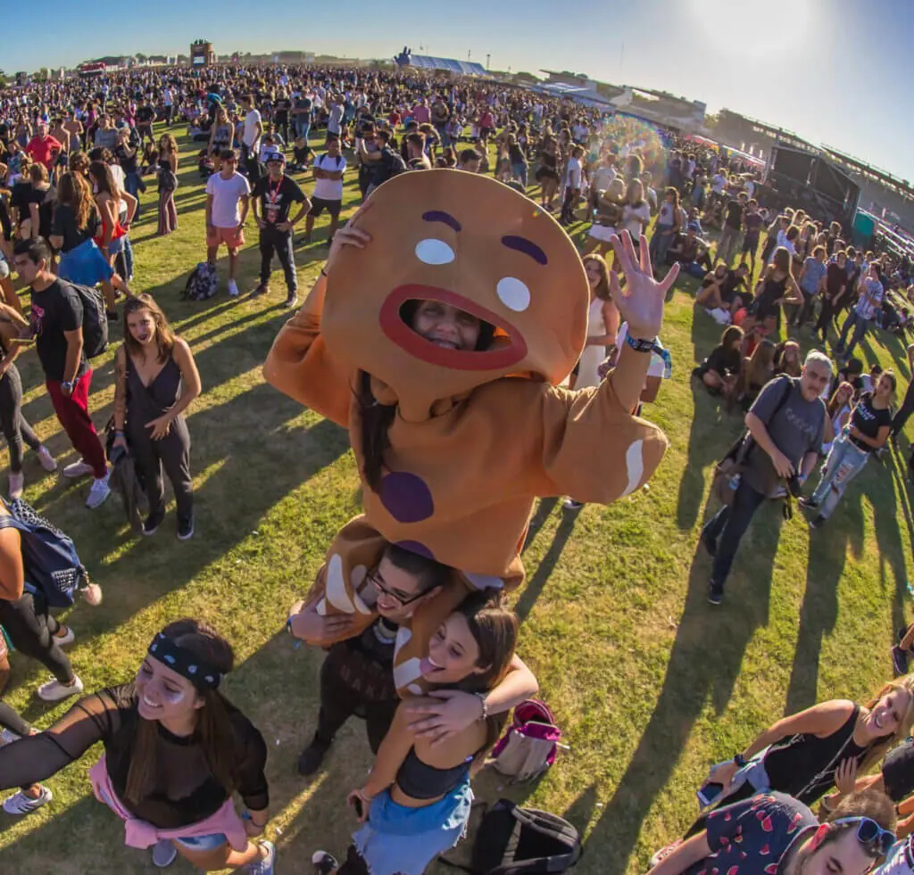 Lollapalooza South America music festivals - Argentina, Brazil, and Chile festivalgoers in a large grassy pasy 