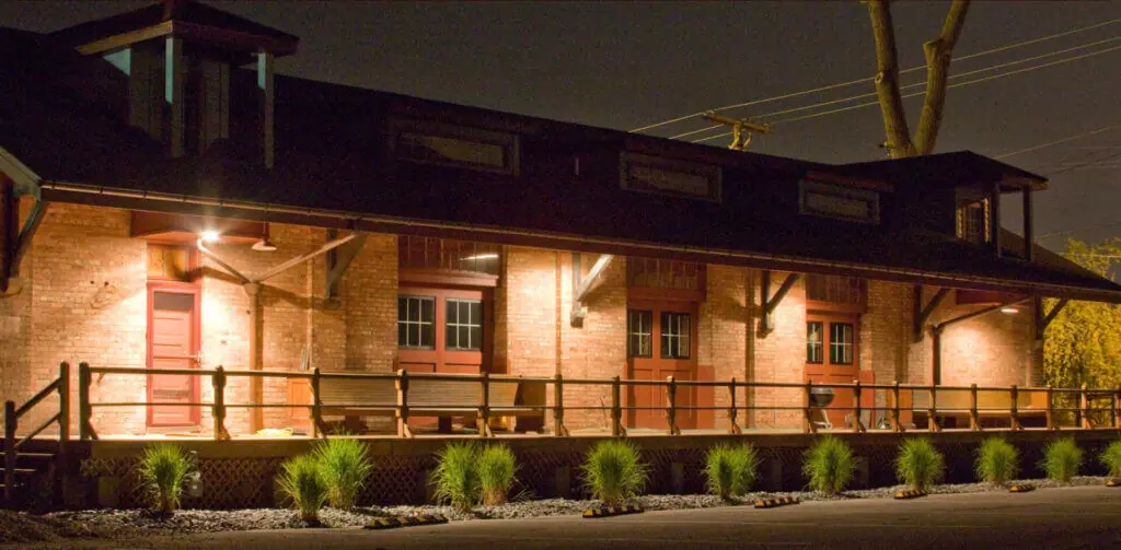Historic exterior of unique place to stay in Indiana: Riley's Railhouse