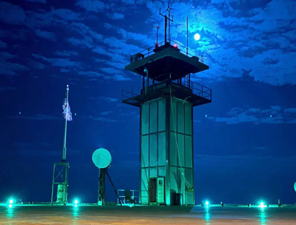 Night view of one of the most unique places to stay in NC, the Frying Pan Tower.