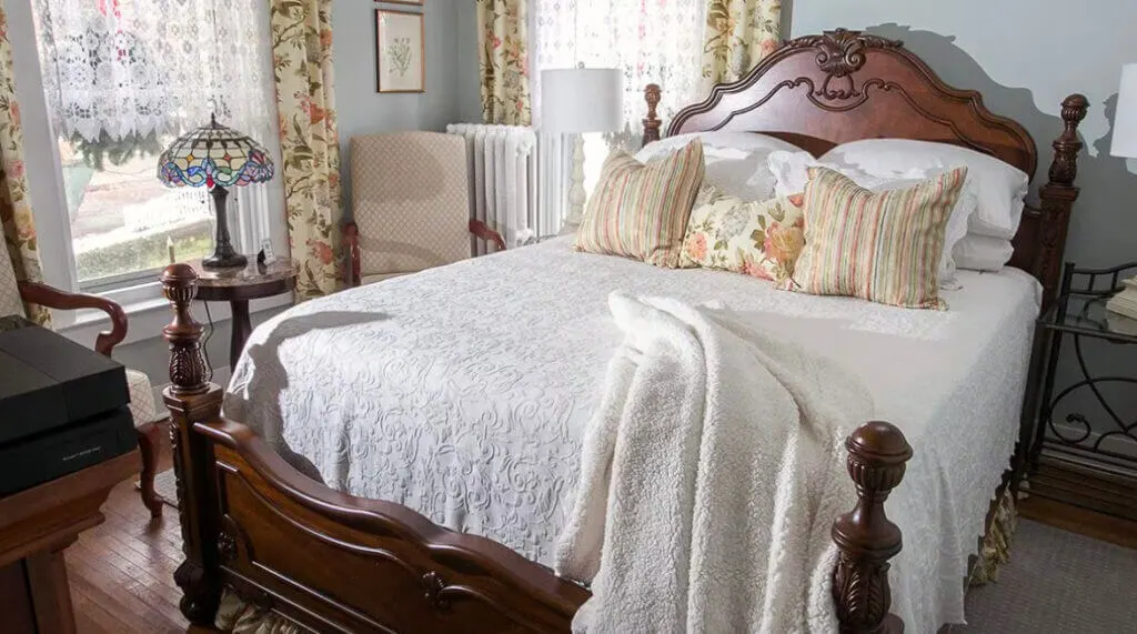 Bed in room of Lamberson Guest House Galena Il