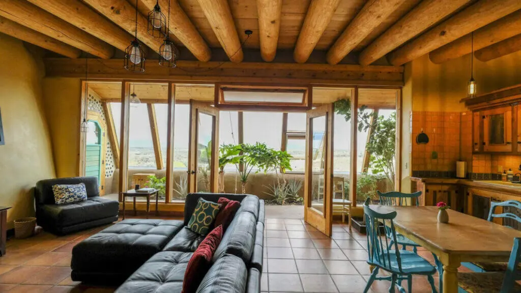Living room and kitchen and uique lodging in NM, Spectacular Earthship