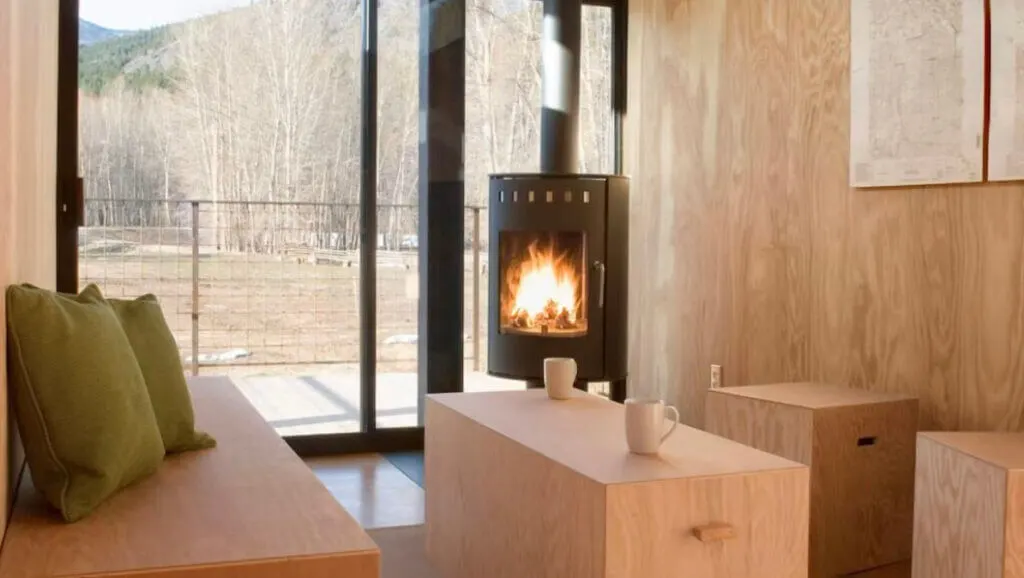 Fireplace inside interior of Rolling Huts Washington State unique place to stay