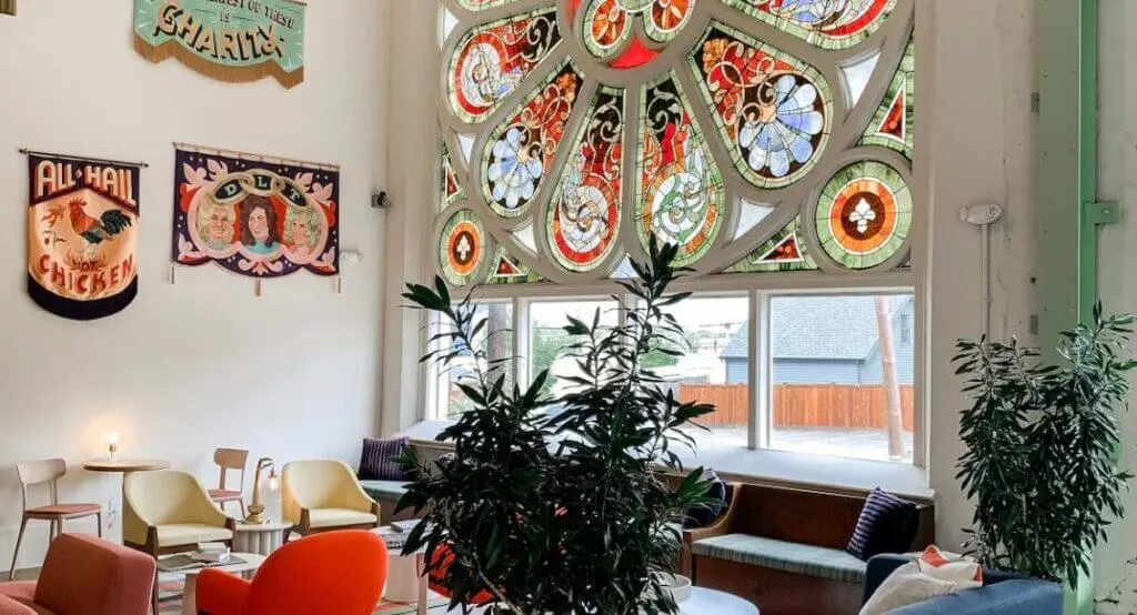 lobby seating area with beautiful church stained glass windows at The Russell Boutique Hotel Tennessee
