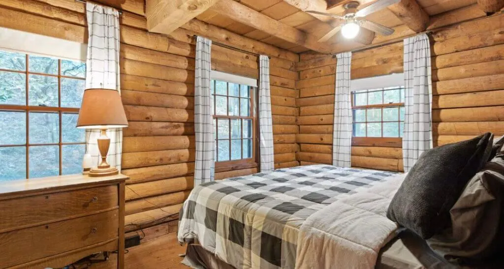 rustic small bedroom at Cozy Pines Cabin Indiana