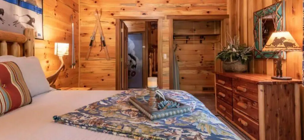 Bedroom with rustic cabin decor at Pappy's Cabin Antler Log Cabin vacation rentals