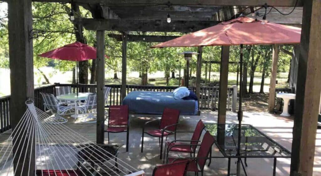 stone creek cabin unique place to stay in oklahoma for large groups porch with a bed