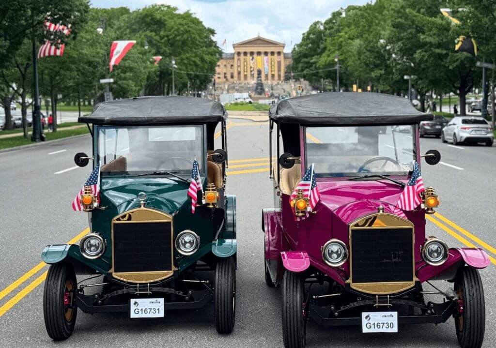 two vintage golf carts in front of the Philadelphia museum of art romantic date idea