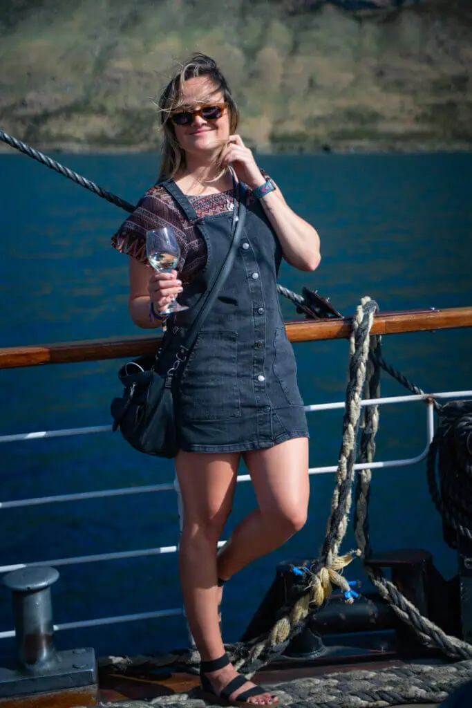 TSS Earnslaw cruise travel blogger Kimmie Conner with wine