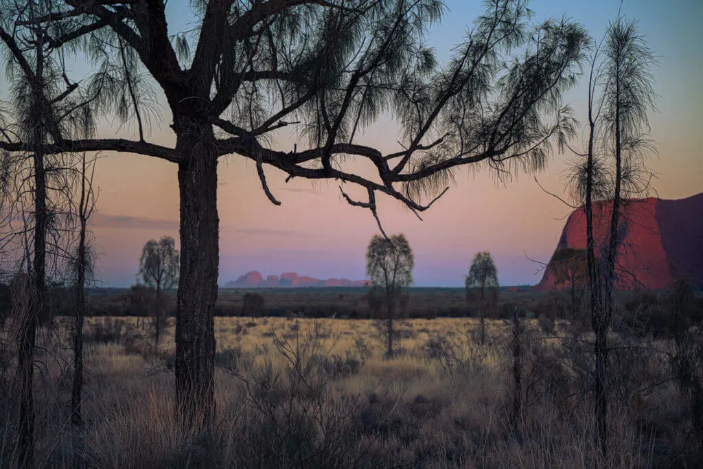 Sunrise over Uluru with Kata Tjuta in the background