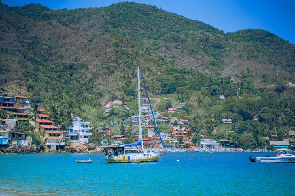 Yelapa Mexico sunny view of the bay and ywllow bottom boat 