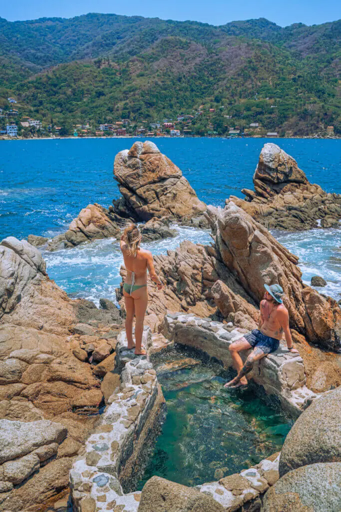 travel couple photo in rock pool yelapa mexico