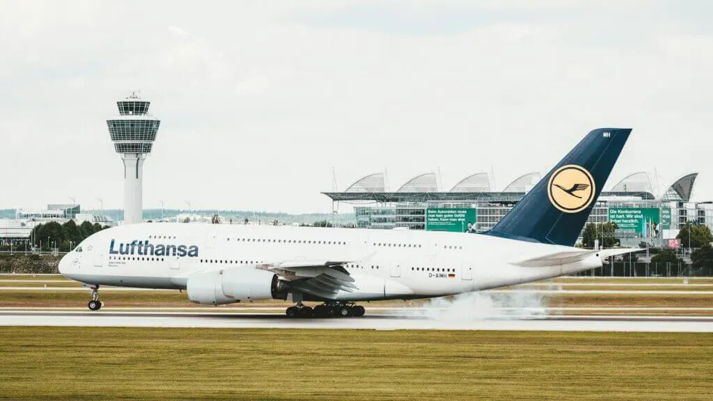 Lufthansa Airbus A380 landing at Munich Airport, showcasing aviation dynamics.