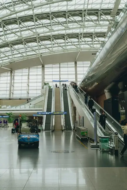 View of the interior of Seoul Incheon Airport with escalators and travelers.