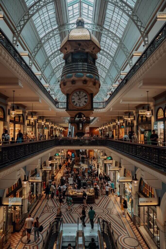 Explore the bustling interior of Sydney's Queen Victoria Building, a landmark shopping destination.
