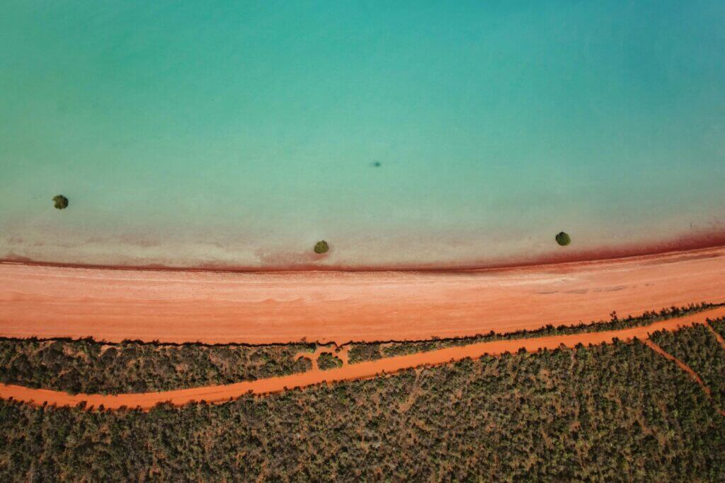 brome red sand and blue water